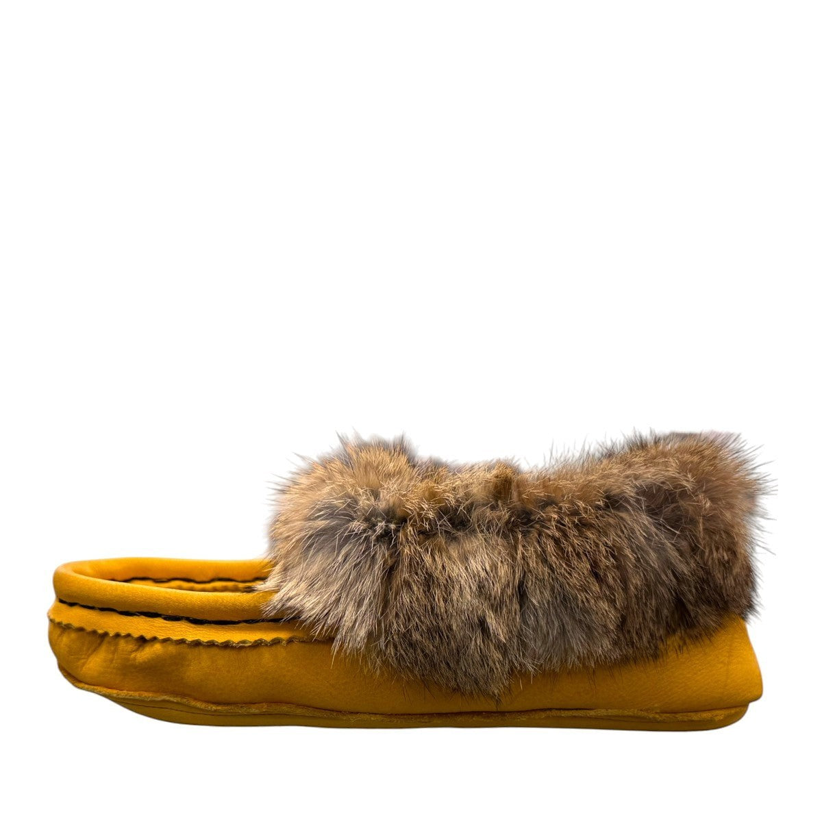 Alberta yellow deer skin leather moccasins with a fluffy rabbit fur ankle collar, handcrafted design.
photo of the left side
