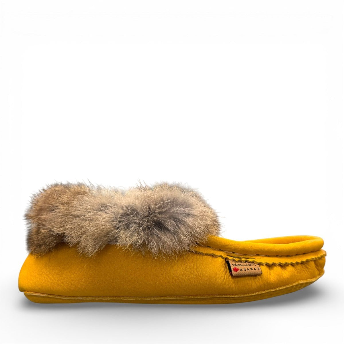 Alberta yellow deer skin leather moccasins with a soft rabbit fur ankle collar, handcrafted design.
photo of the right side