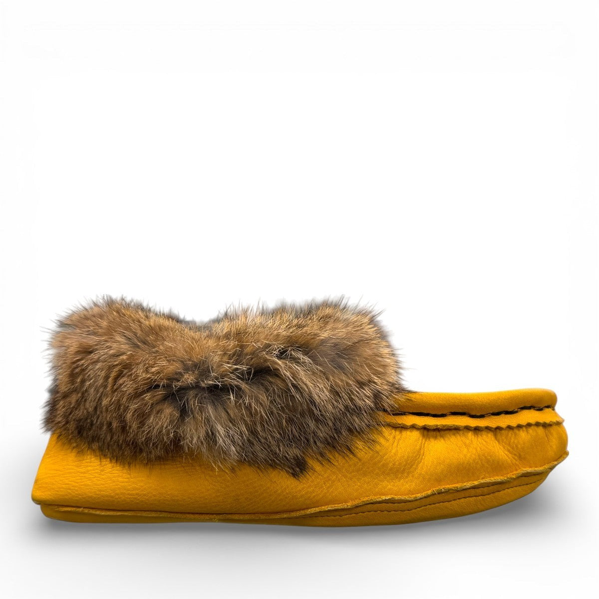 Alberta yellow deer skin leather moccasins with a fluffy rabbit fur ankle collar, handcrafted design.
photo of the right side