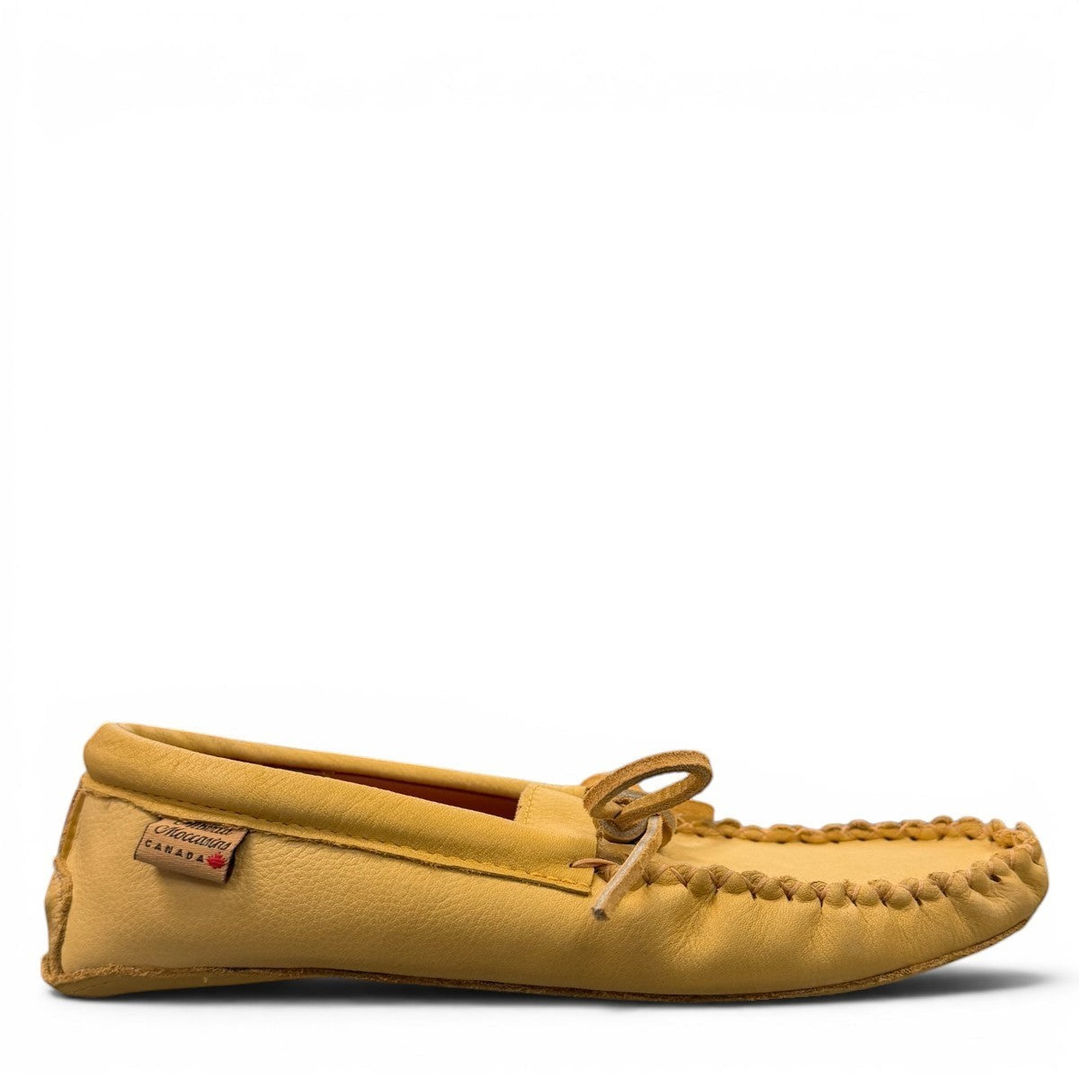 Alberta yellow genuine caribou hide leather moccasins with a soft double leather sole and lace-up front.
photo of the right side