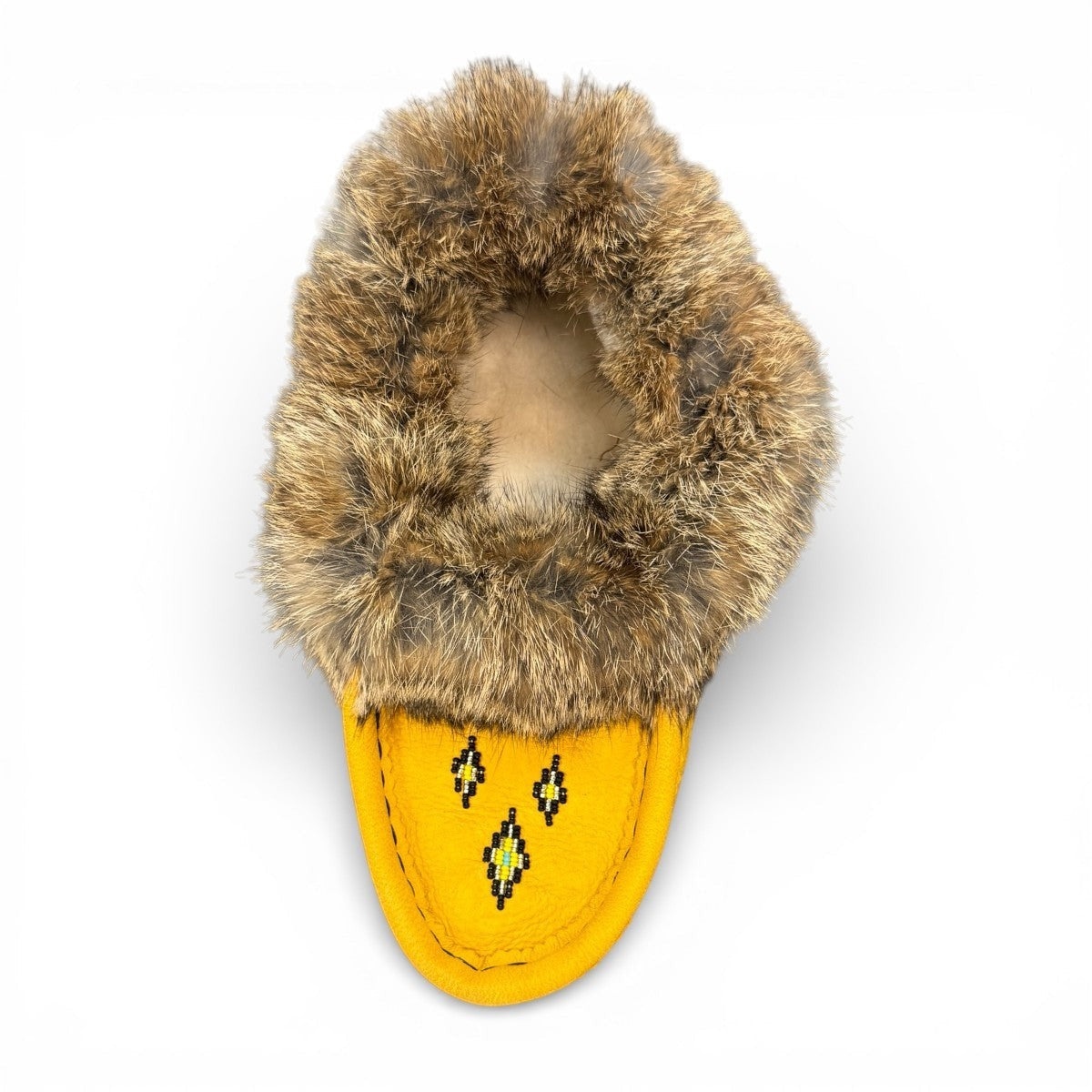 Alberta yellow deer skin leather moccasins with a fluffy rabbit fur ankle collar, handcrafted design.
photo of the top side