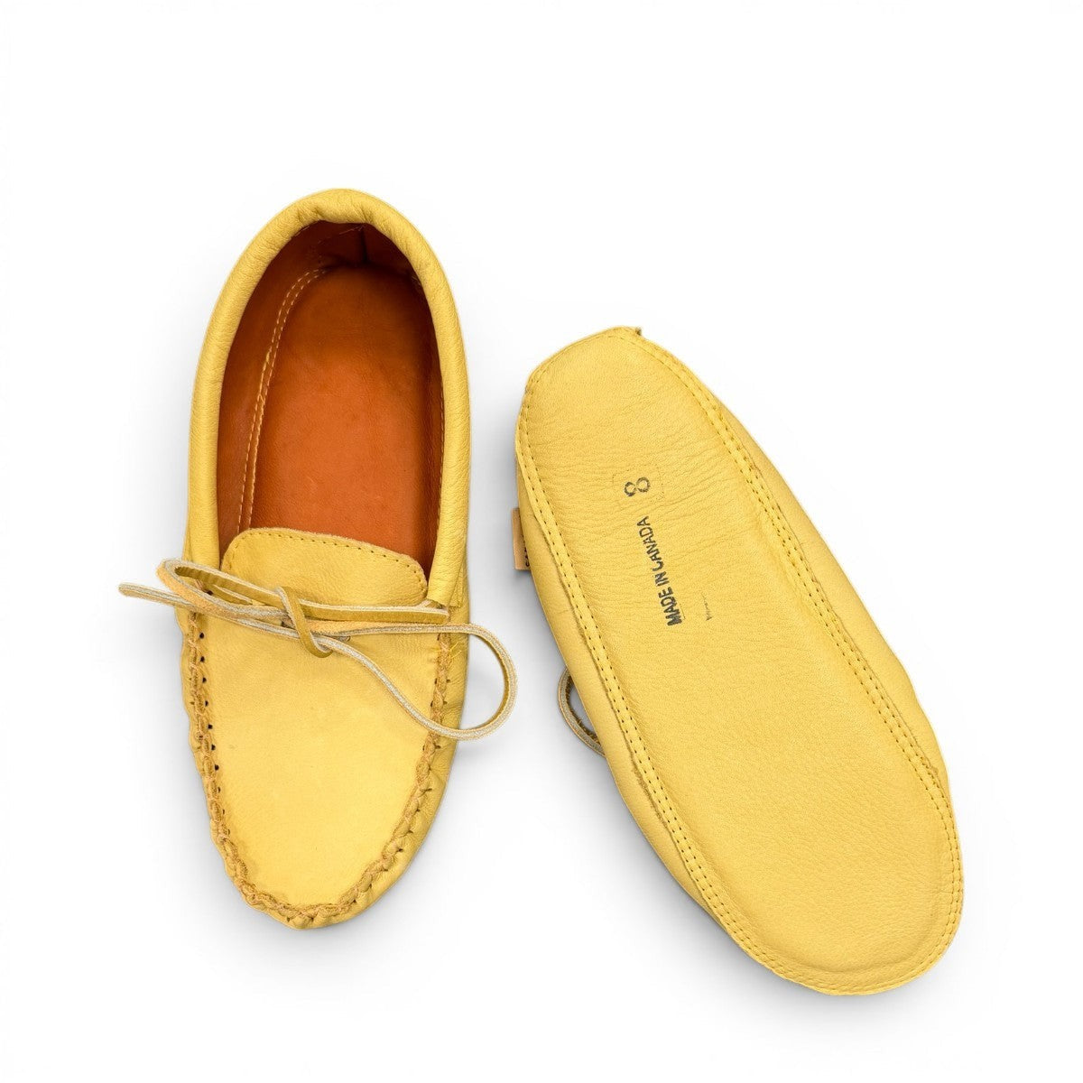 Alberta yellow genuine caribou hide leather moccasins with a soft double leather sole and lace-up front.
photo of the bottom side