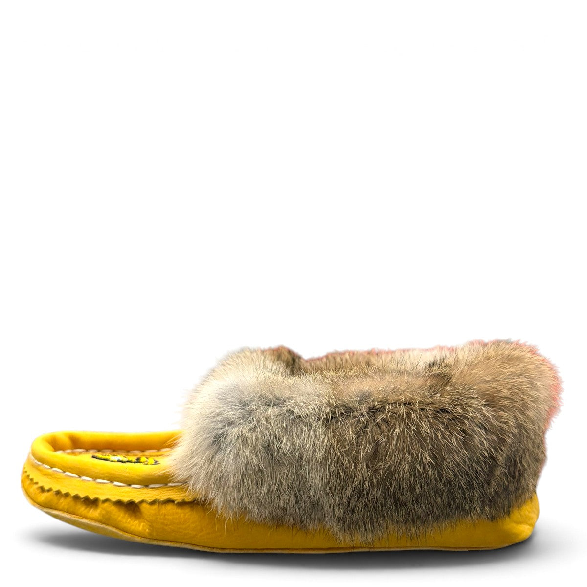 Alberta yellow suede moccasins with rabbit fur trim, handcrafted leather slippers for cozy everyday wear. Photo of left side view.