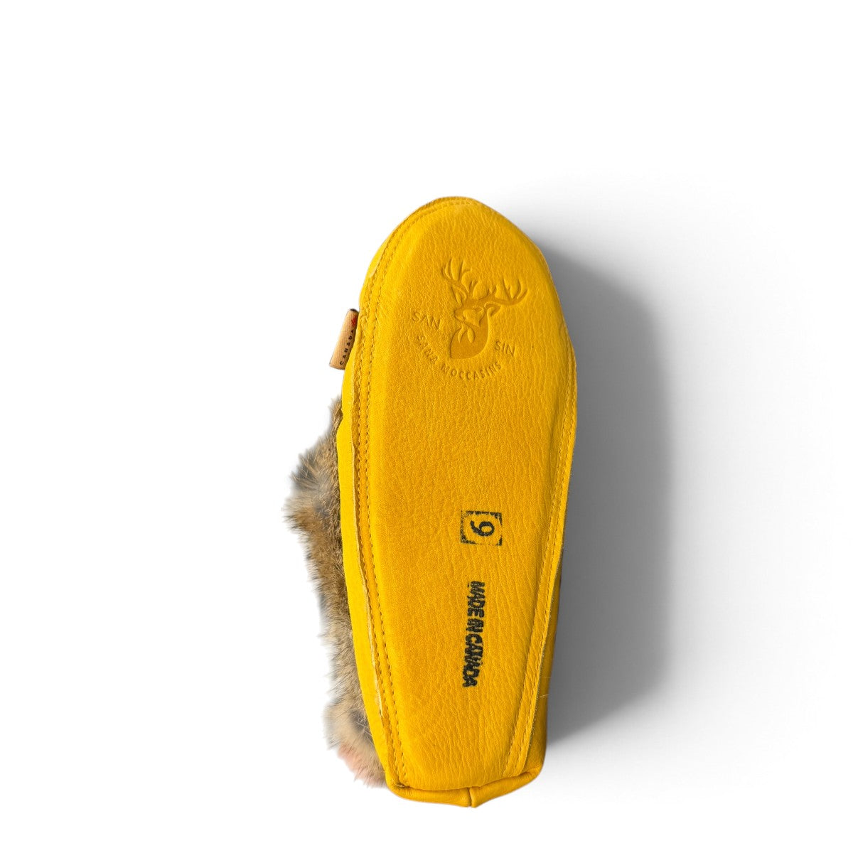 Alberta yellow suede moccasins with rabbit fur trim, handcrafted leather slippers for cozy everyday wear. Photo of bottom view.
