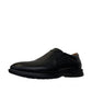 Atropat Azarbad black leather slip-on shoes with handmade stitching and durable rubber outsole. Photo of side view at an angle.