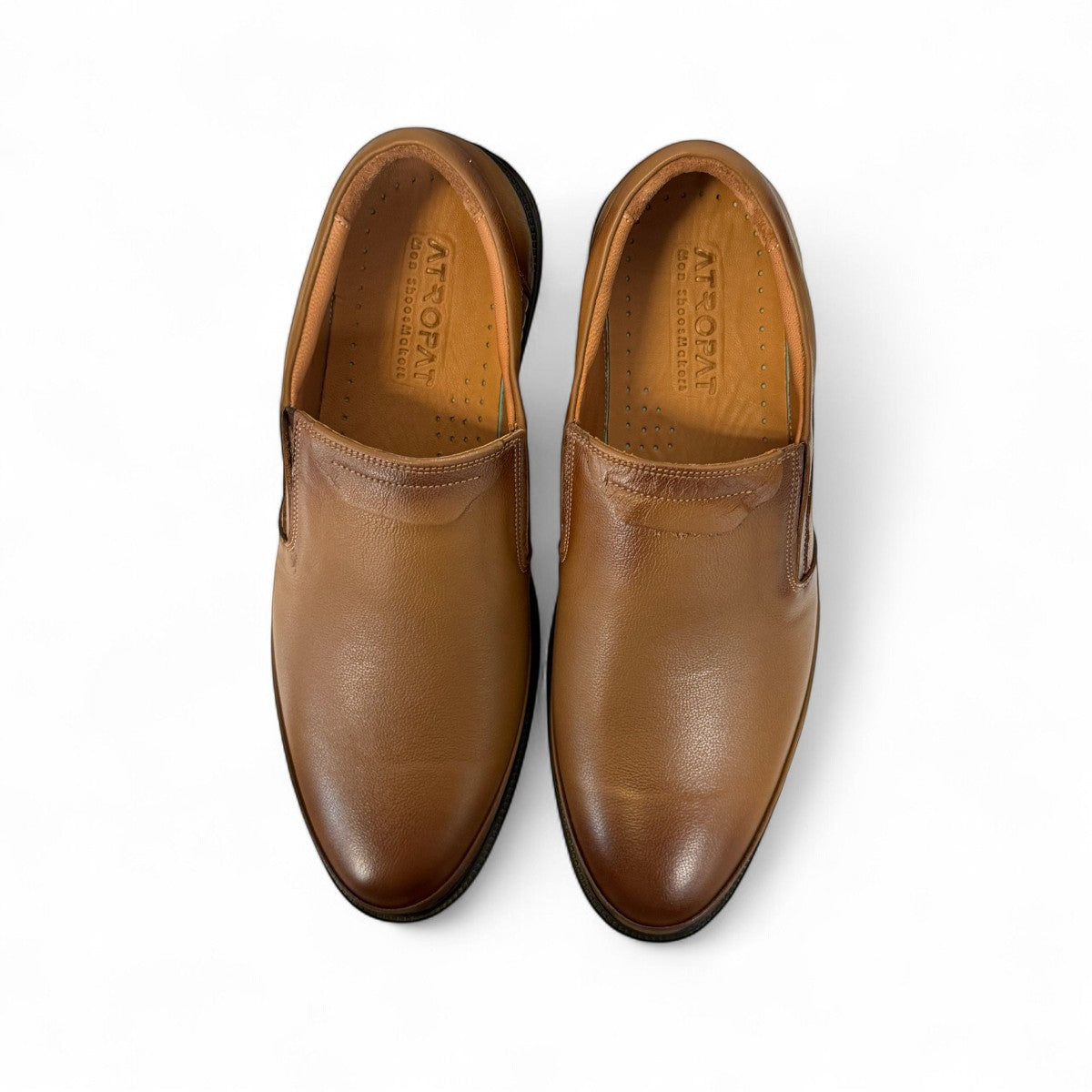 Atropat Azarbad brown leather slip-on shoes with handmade stitching and a durable black rubber sole. Photo of upper view.