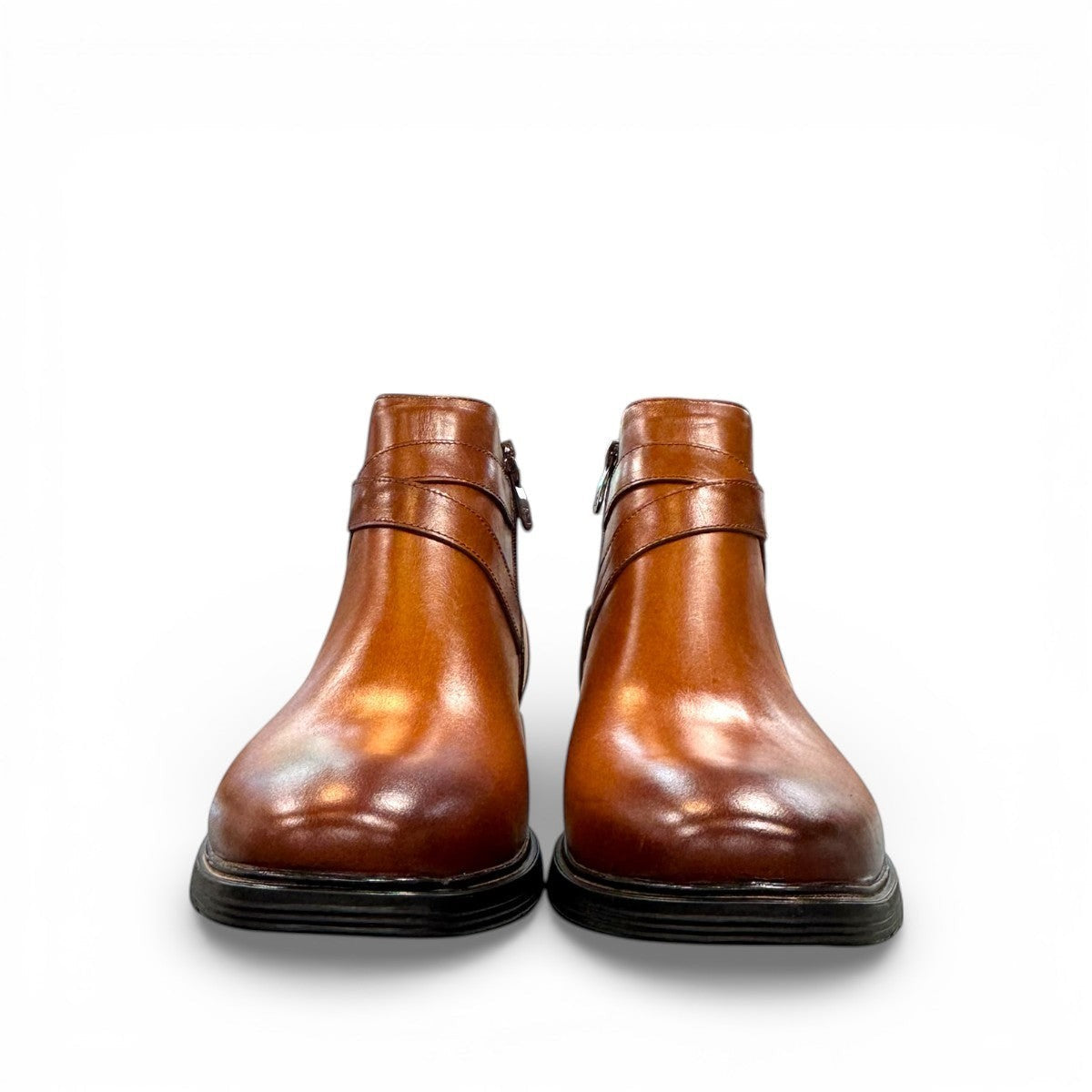 Brown leather ankle boots with a side buckle strap and durable rubber sole for formal wear. Photo of front view.