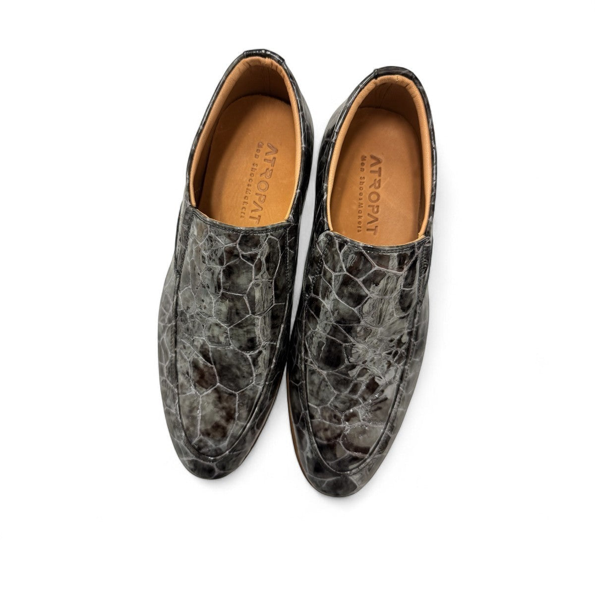 Atropat Diyan grey marble patent leather slip-on dress shoe with a durable rubber outsole. Photo of the soles.