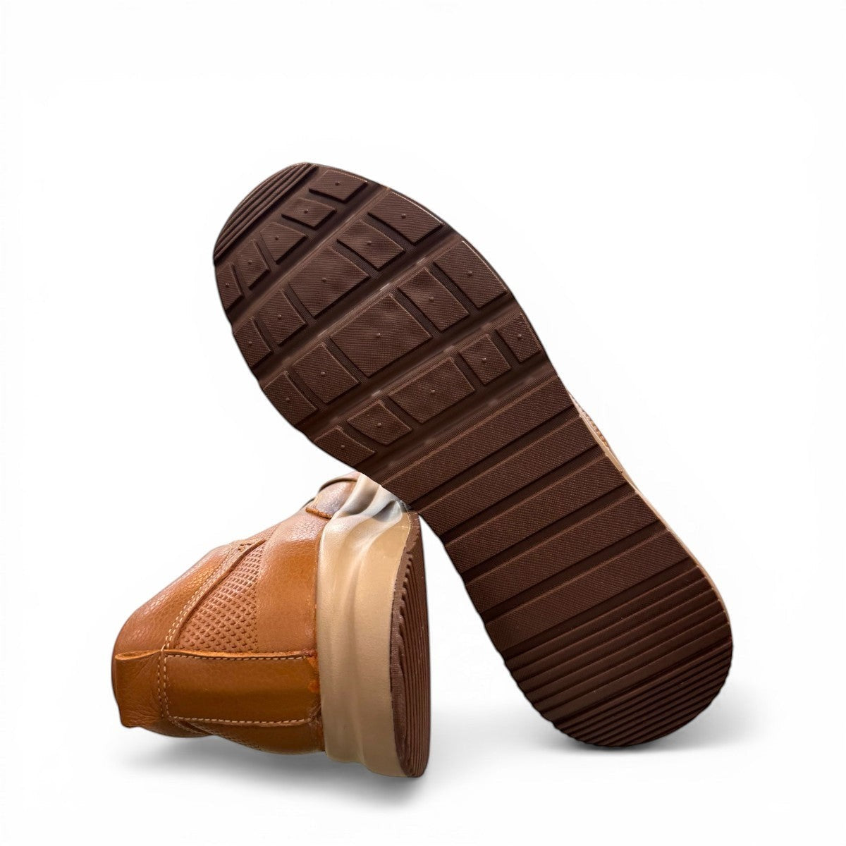 Atropat Kaya brown leather slip-on shoes with textured upper, rubber sole, and handmade stitching. Photo of bottom view.