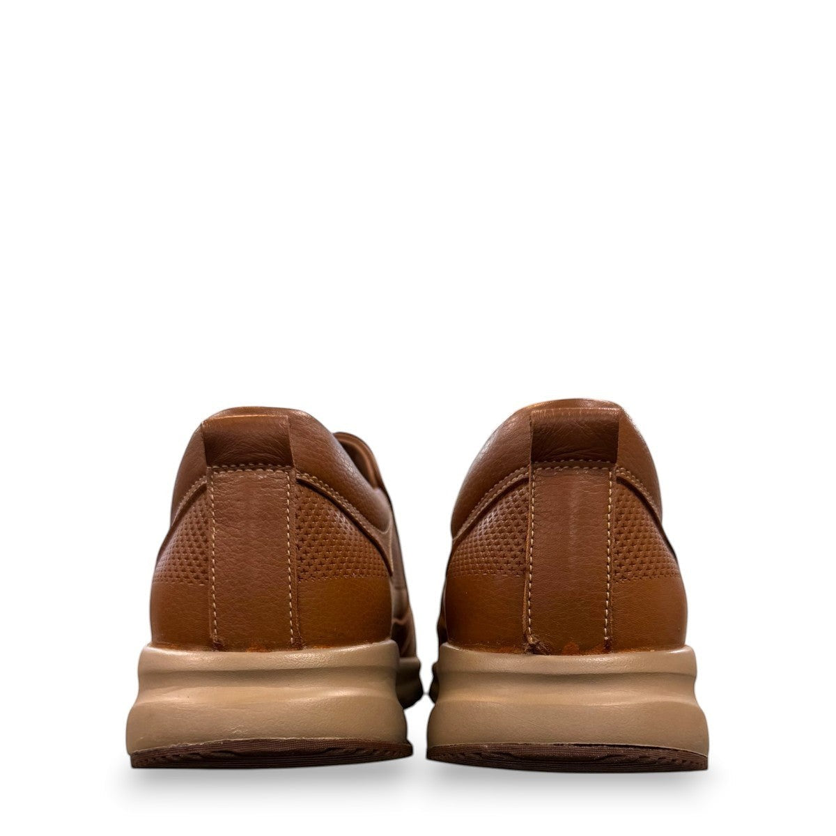 Atropat Kaya brown leather slip-on shoes with textured upper, rubber sole, and handmade stitching. Photo of back view.