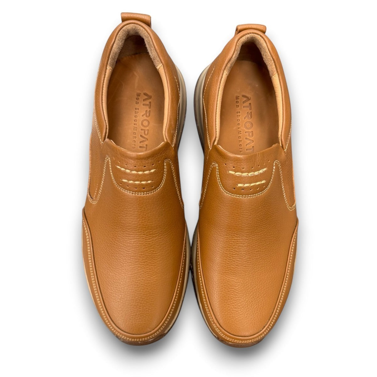 Atropat Kaya brown leather slip-on shoes with textured upper, rubber sole, and handmade stitching. Photo of upper view.