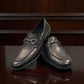 Bottero  black leather loafers with a metal horsebit detail and a classic slip-on silhouette.