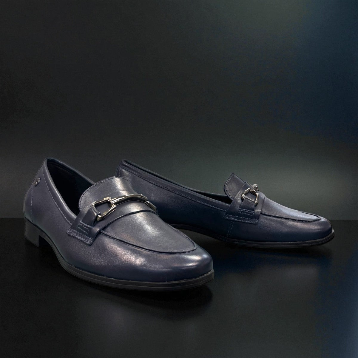 Bottero navy leather loafer with a metal horsebit detail and a low flat heel in a classic slip-on style