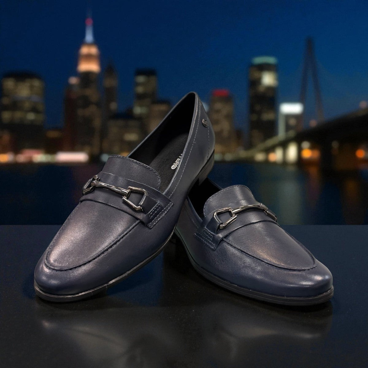 Bottero navy leather loafer with a metal horsebit detail and a low flat heel in a classic slip-on style