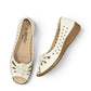 COLLEXION-F7067M white peep-toe comfort flats with floral detail, side perforations, and a flexible brown sole.
photo of the top side