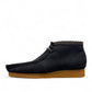 Sina Footwear blue leather Shacre boots with a Wallabee-inspired design, lace-up vamp, and durable rubber sole. Photo of the left side.
