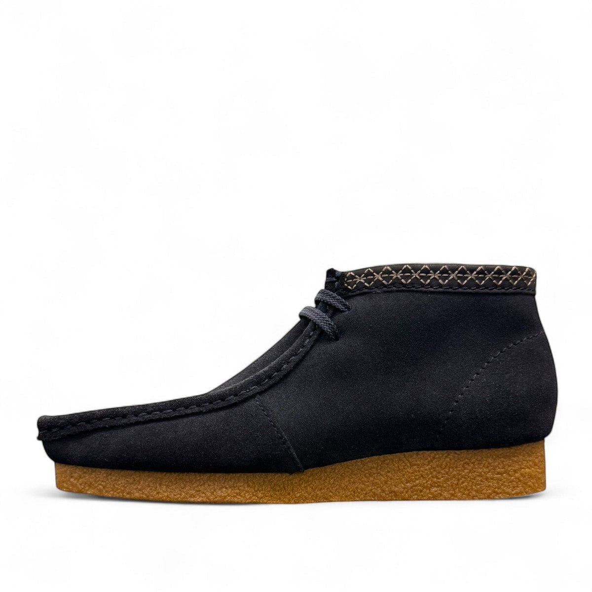 Sina Footwear blue leather Shacre boots with a Wallabee-inspired design, lace-up vamp, and durable rubber sole. Photo of the left side.
