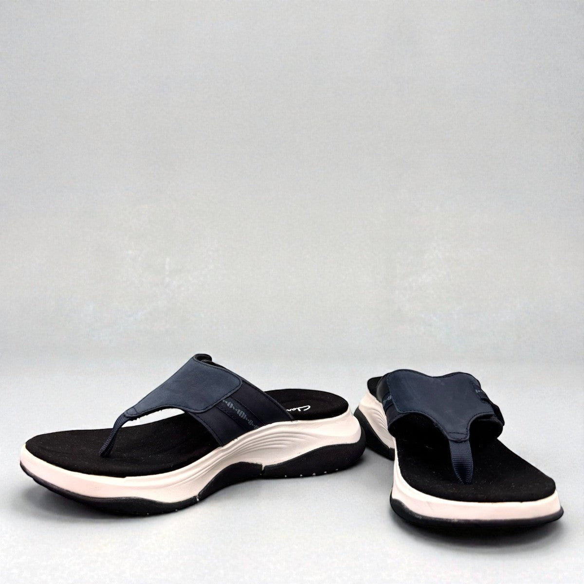 Clarks Wave 2.0 Sea navy nubuck thong sandal with curved WaveWalk sole and cushioned footbed. photo of the front.