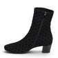 DJANGO & JULIETTE Hartful black stretch ankle bootie with polka dot pattern and block heel.
photo of the left side