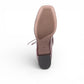 Django & Juliette burgundy leather ankle boots with a black patent square toe, block heel, and lace detail. bottom view.