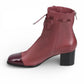 Django & Juliette burgundy leather ankle boots with a black patent square toe, block heel, and lace detail. left view