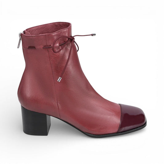 Django & Juliette burgundy leather ankle boots with a black patent square toe, block heel, and lace detail. right view.