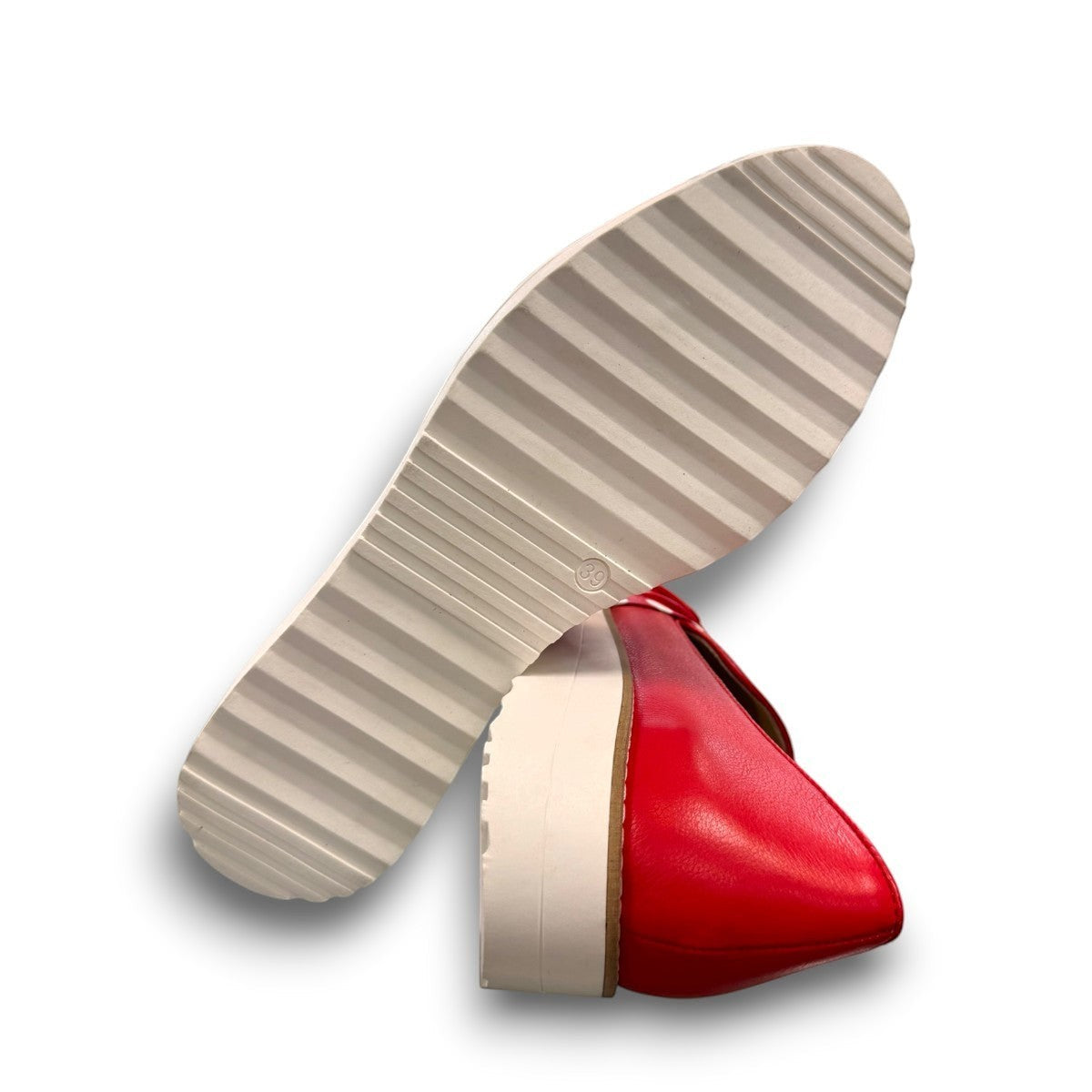 DJANGO & JULIETTE red leather platform loafers with white polka dot bow detail and white rubber wedge.
bottom view.
