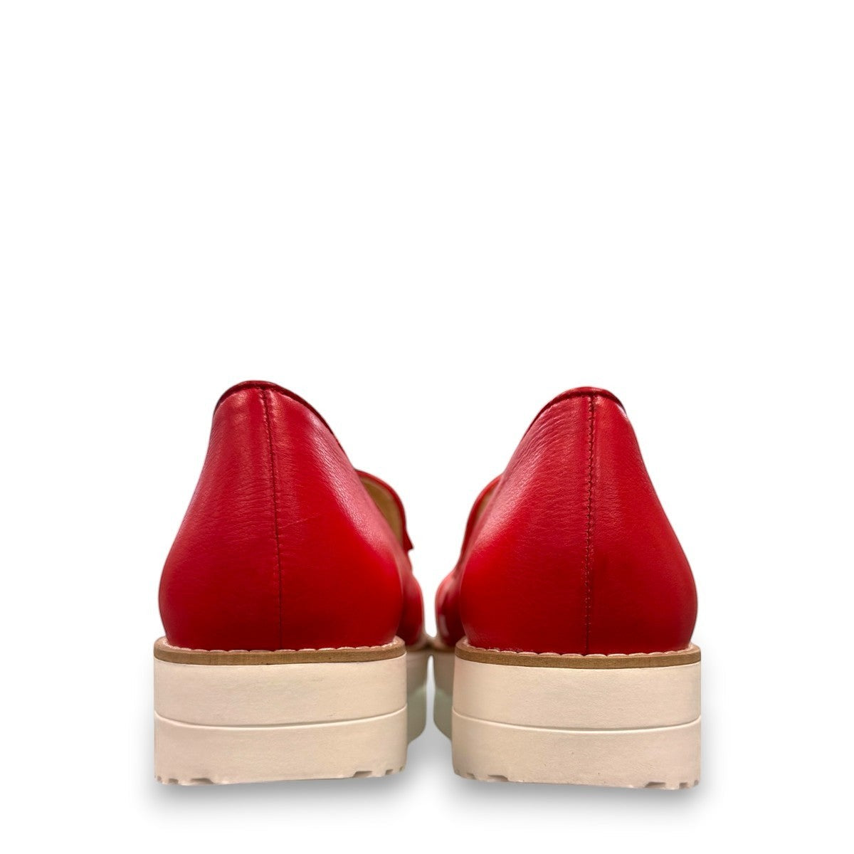DJANGO & JULIETTE red leather platform loafers with white polka dot bow detail and white rubber wedge.
back view.
