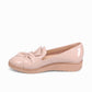 DJANGO & JULIETTE OCLEM cappuccino patent leather platform loafers with a bow detail and low wedge sole. left side.