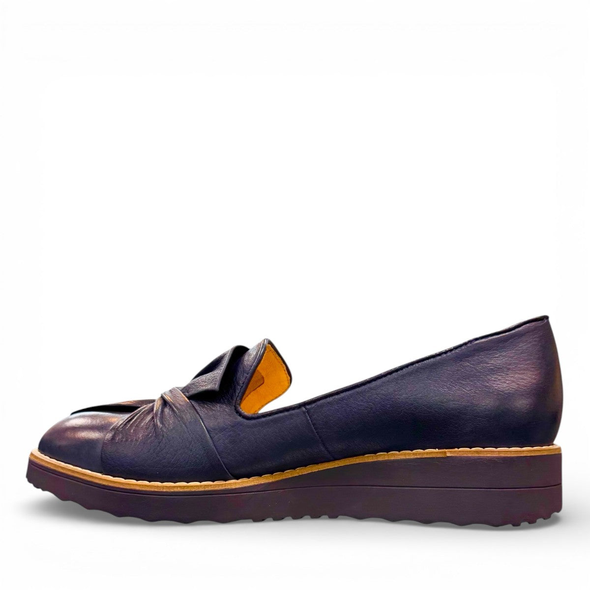 DJANGO & JULIETTE OCLEM navy leather platform loafers with a sporty rubber wedge sole and slip-on design. left view