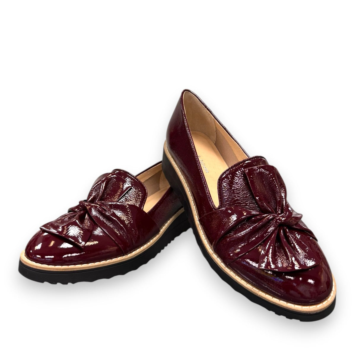 DJANGO & JULIETTE OCLEM wine patent leather platform loafers with a black rubber wedge sole. front view.