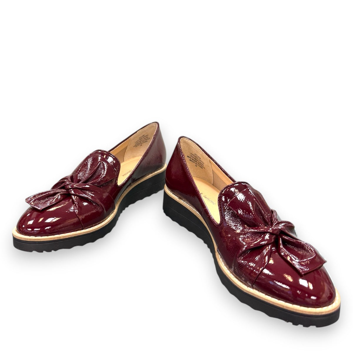 DJANGO & JULIETTE OCLEM wine patent leather platform loafers with a black rubber wedge sole. front view.