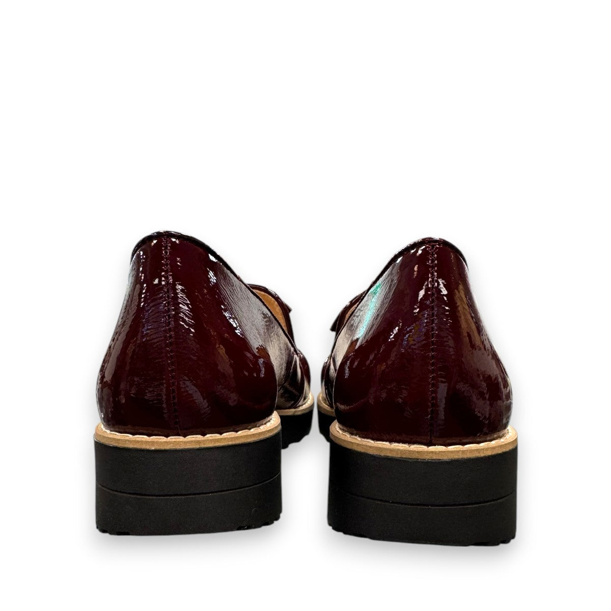 DJANGO & JULIETTE OCLEM wine patent leather platform loafers with a black rubber wedge sole. back view.