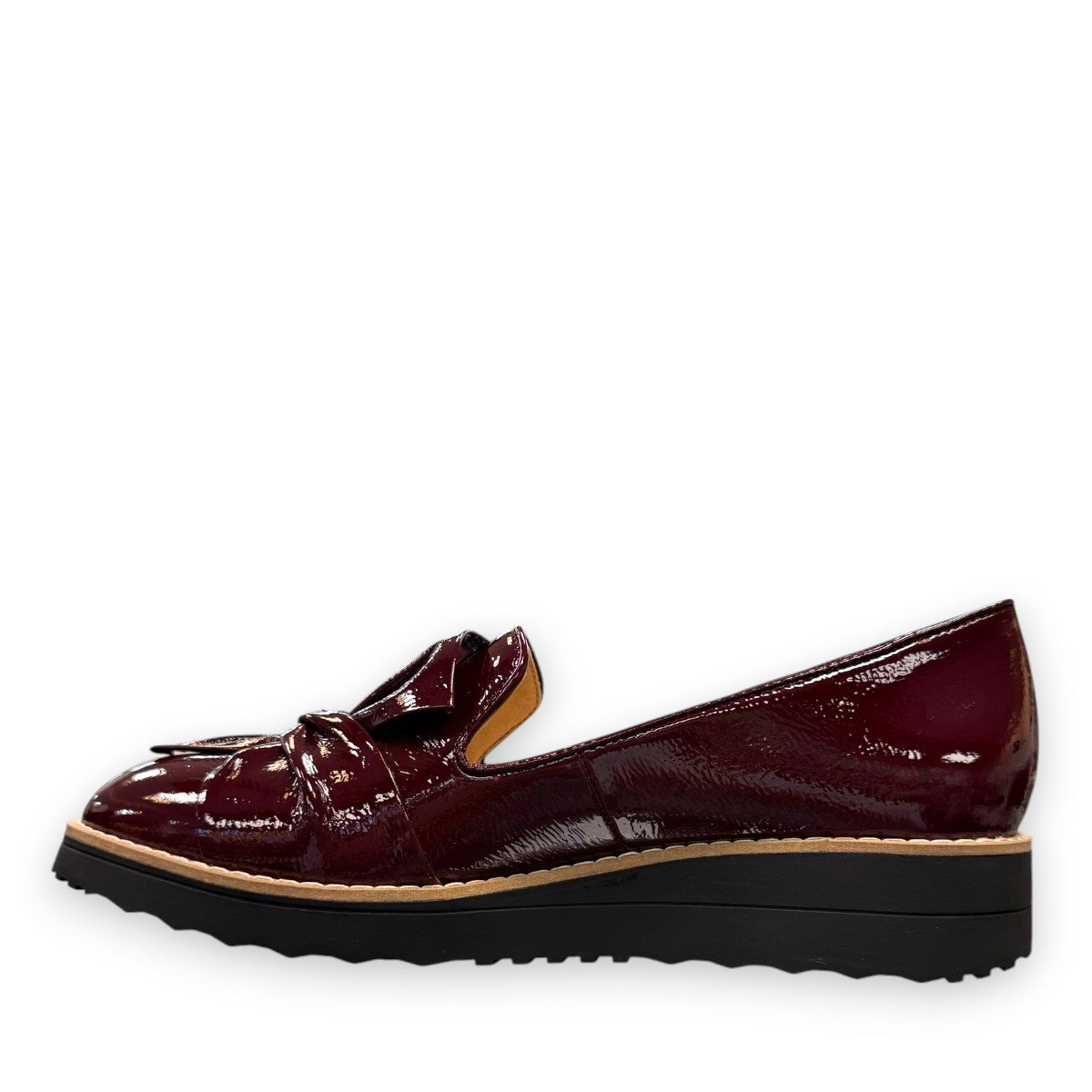 DJANGO & JULIETTE OCLEM wine patent leather platform loafers with a black rubber wedge sole. left view.