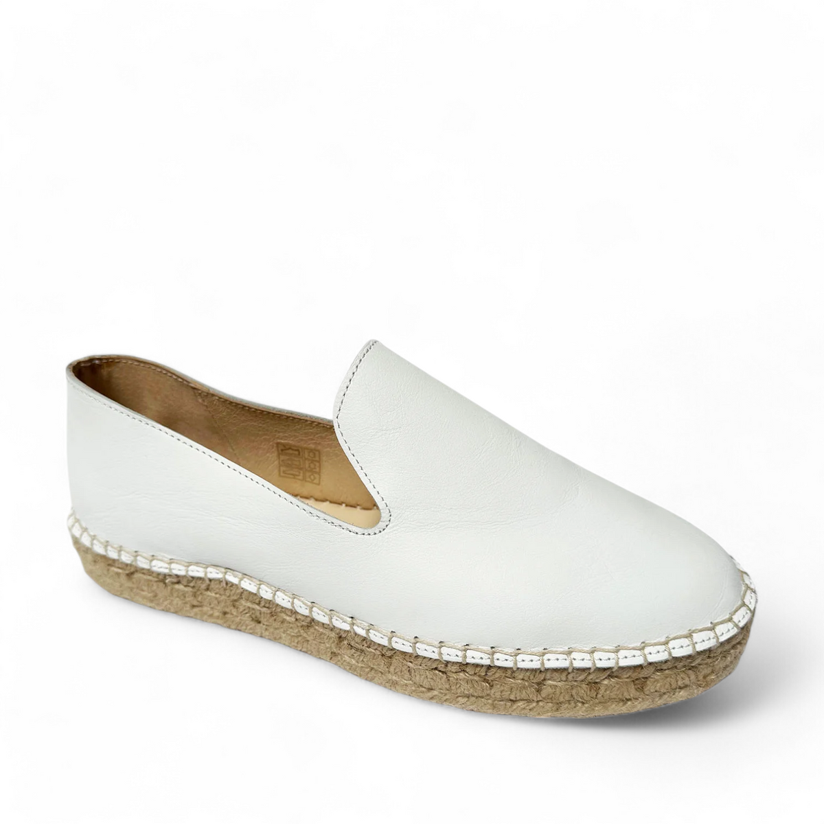 David Tyler Copete white leather slip-on espadrilles with a braided rope platform sole. Photo of front side view.