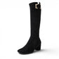 Django & Juliette black microsuede knee-high boots with square toe, block heel, and gold buckle detail.
photo of the front side