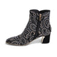 Django & Juliette black suede ankle boots with rhinestone paisley patterns and metallic block heels. Photo of left side view.