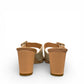 Django & Juliette Conrade camel and almond leather heeled mule sandals with a decorative buckle. Photo of back view.