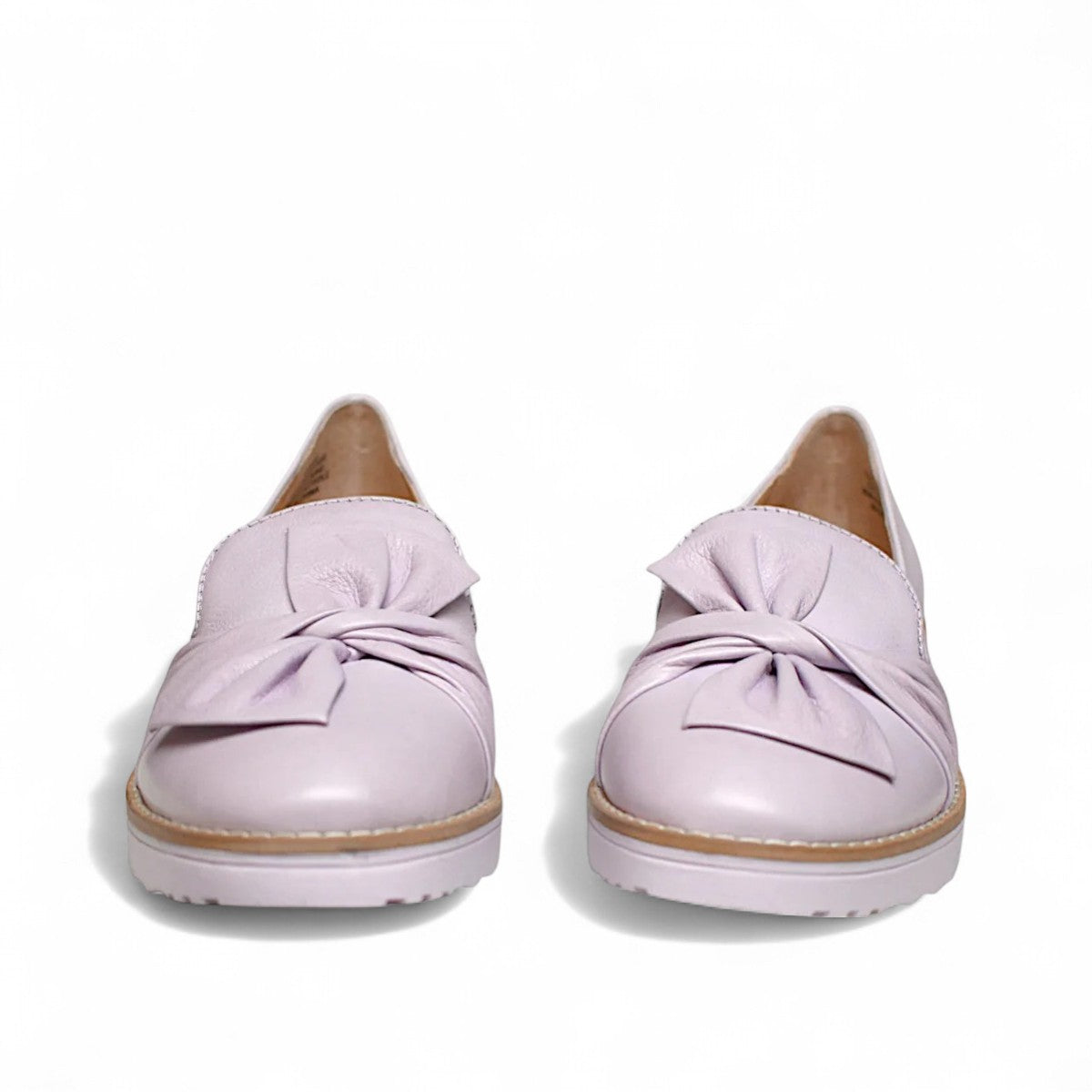 DJANGO & JULIETTE lilac leather platform loafers with a sporty rubber wedge sole and slip-on design. Photo of front view.