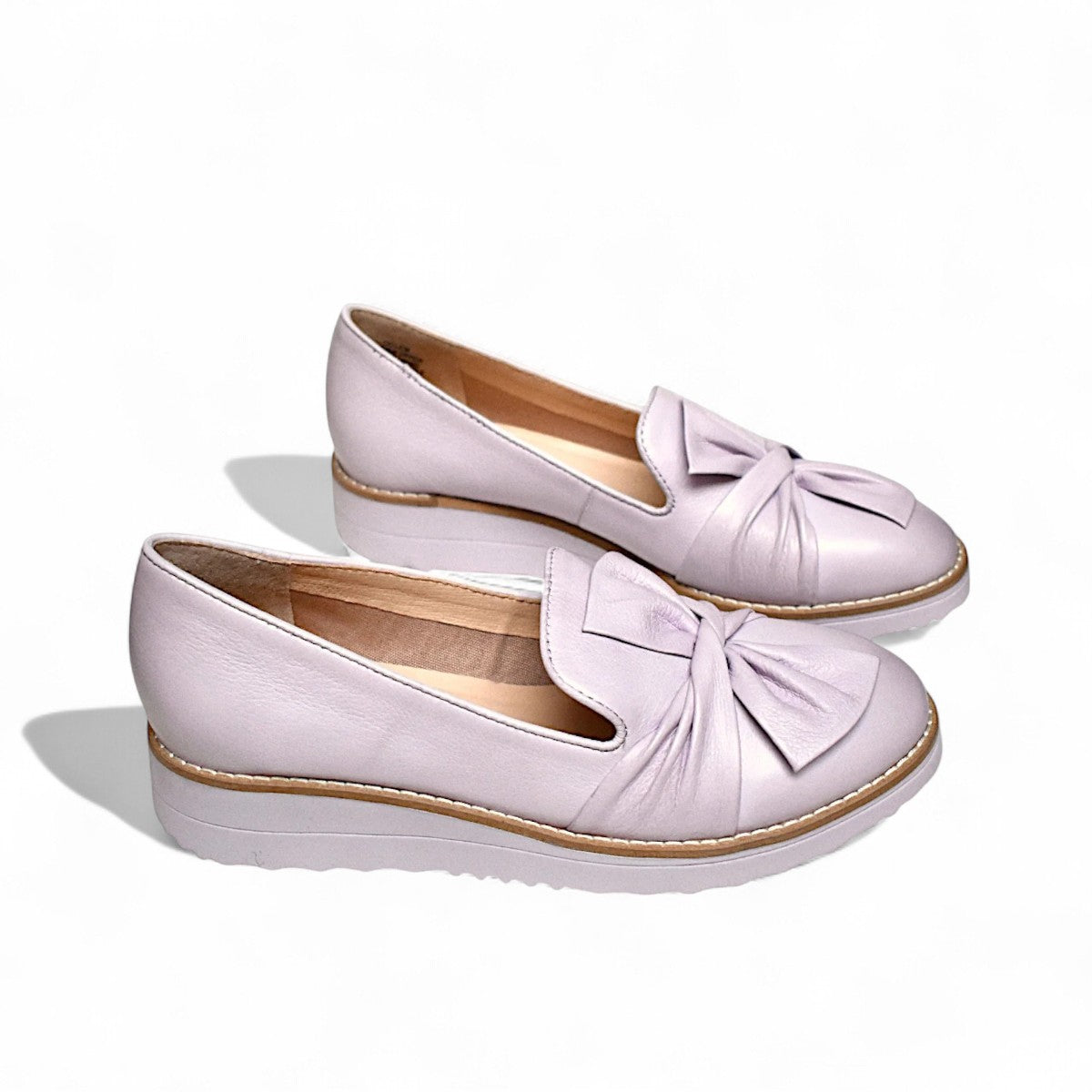 DJANGO & JULIETTE lilac leather platform loafers with a sporty rubber wedge sole and slip-on design. Photo of side views.