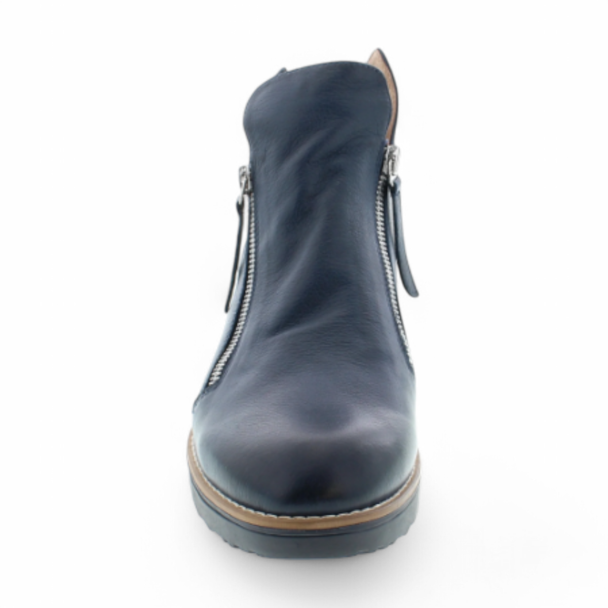 DJANGO & JULIET navy leather ankle boots with asymmetrical front zip, rounded toe, and low wedge heel. Photo of front view.
