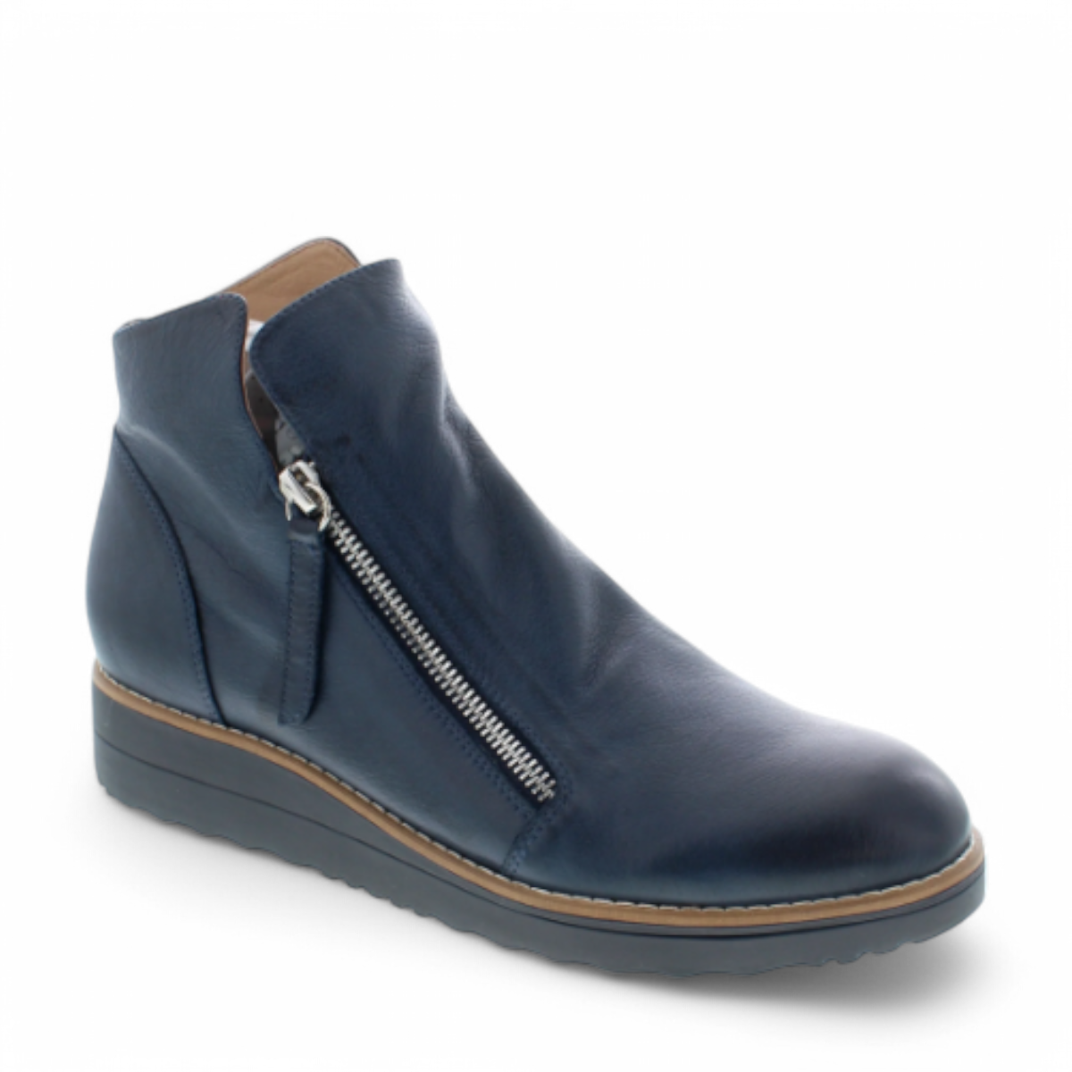 DJANGO & JULIET navy leather ankle boots with asymmetrical front zip, rounded toe, and low wedge heel. Photo of front side view.