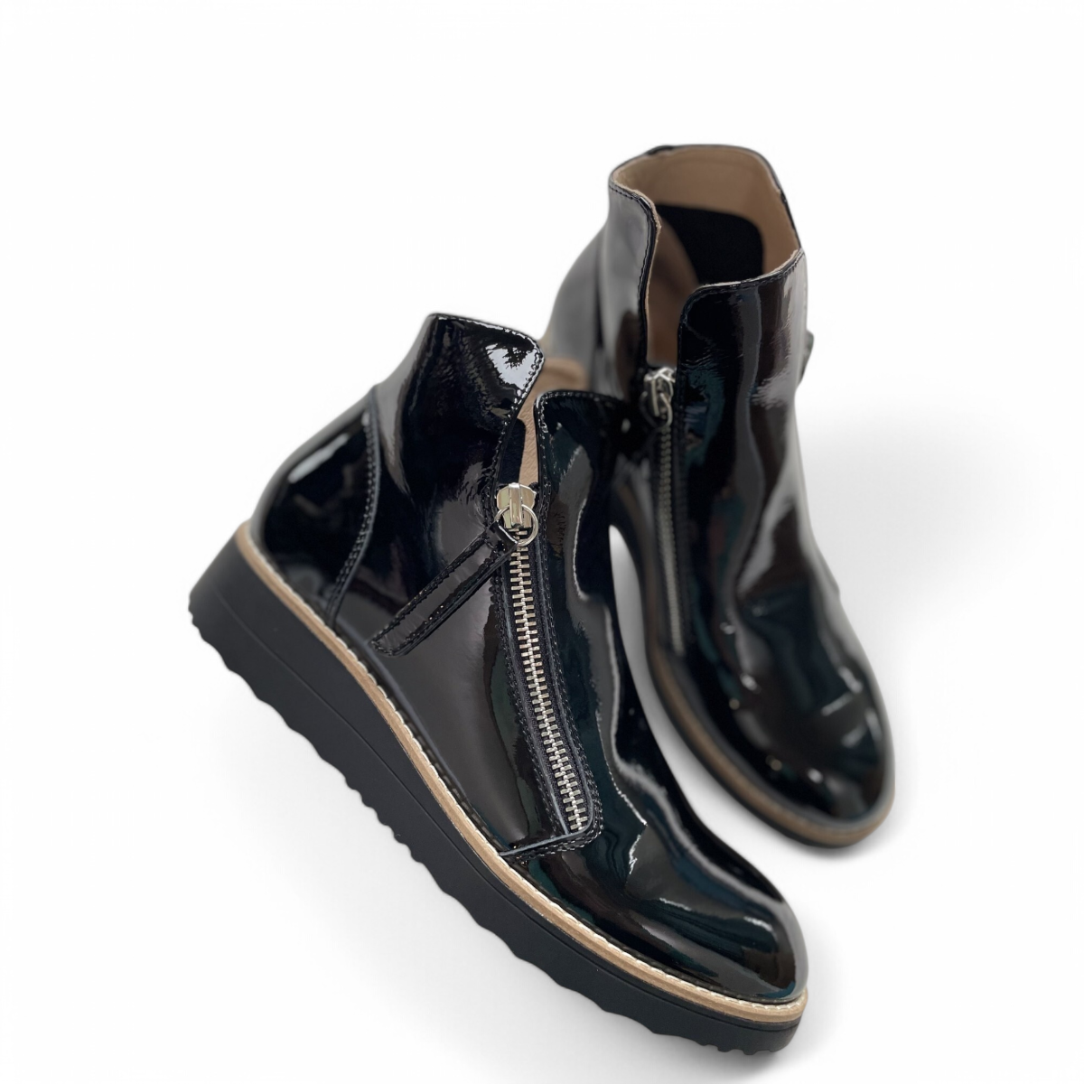 DJANGO & JULIET black patent leather ankle boots with asymmetrical front zip and low wedge heel. Photo of side views.