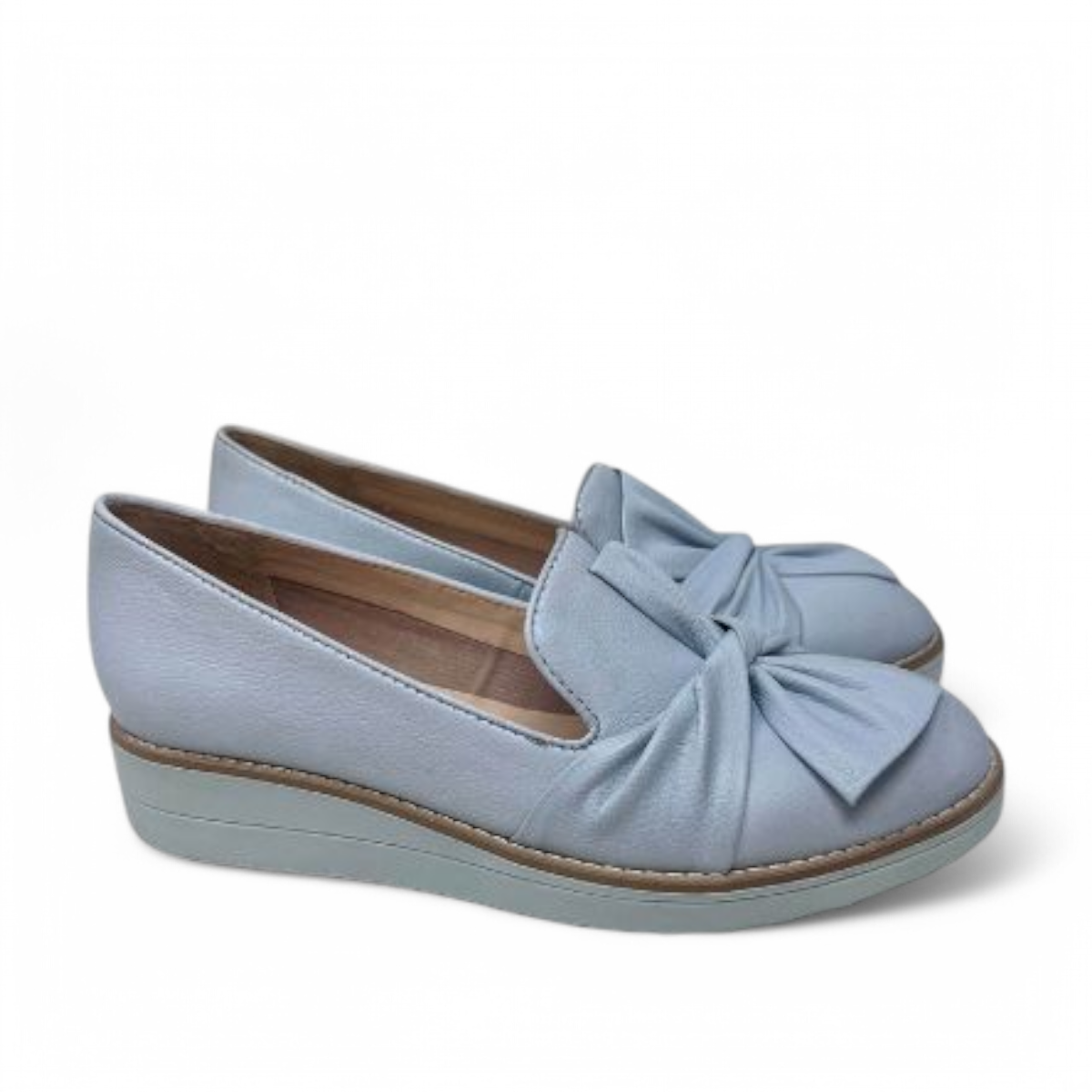 DJANGO & JULIETTE pale blue leather platform loafers with a bow detail and sporty rubber wedge sole. Photo of side views.