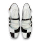DJANGO & JULIETTE Brynns black and white patent leather slingback Mary Jane flat with buckled straps. top view.