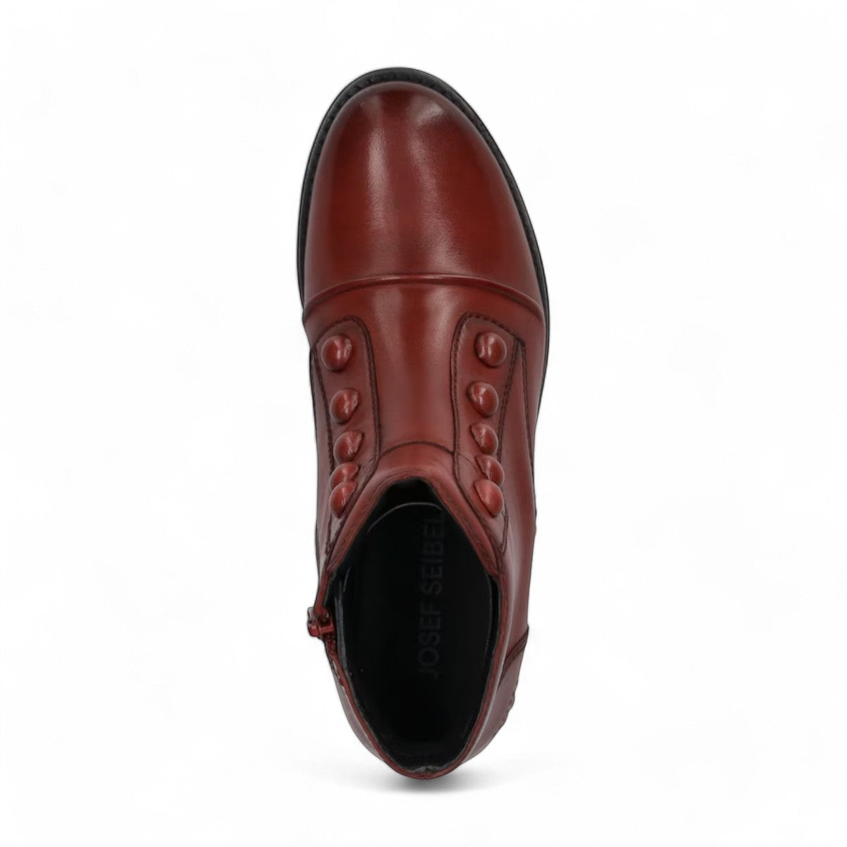 Josef Seibel Simona 04 red leather ankle boots with decorative front buttons and low stacked heel.
photo of the top.