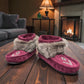 Laurentian Chief Nuka bordeaux suede moccasin with fur trim, beaded details, and black crepe sole.