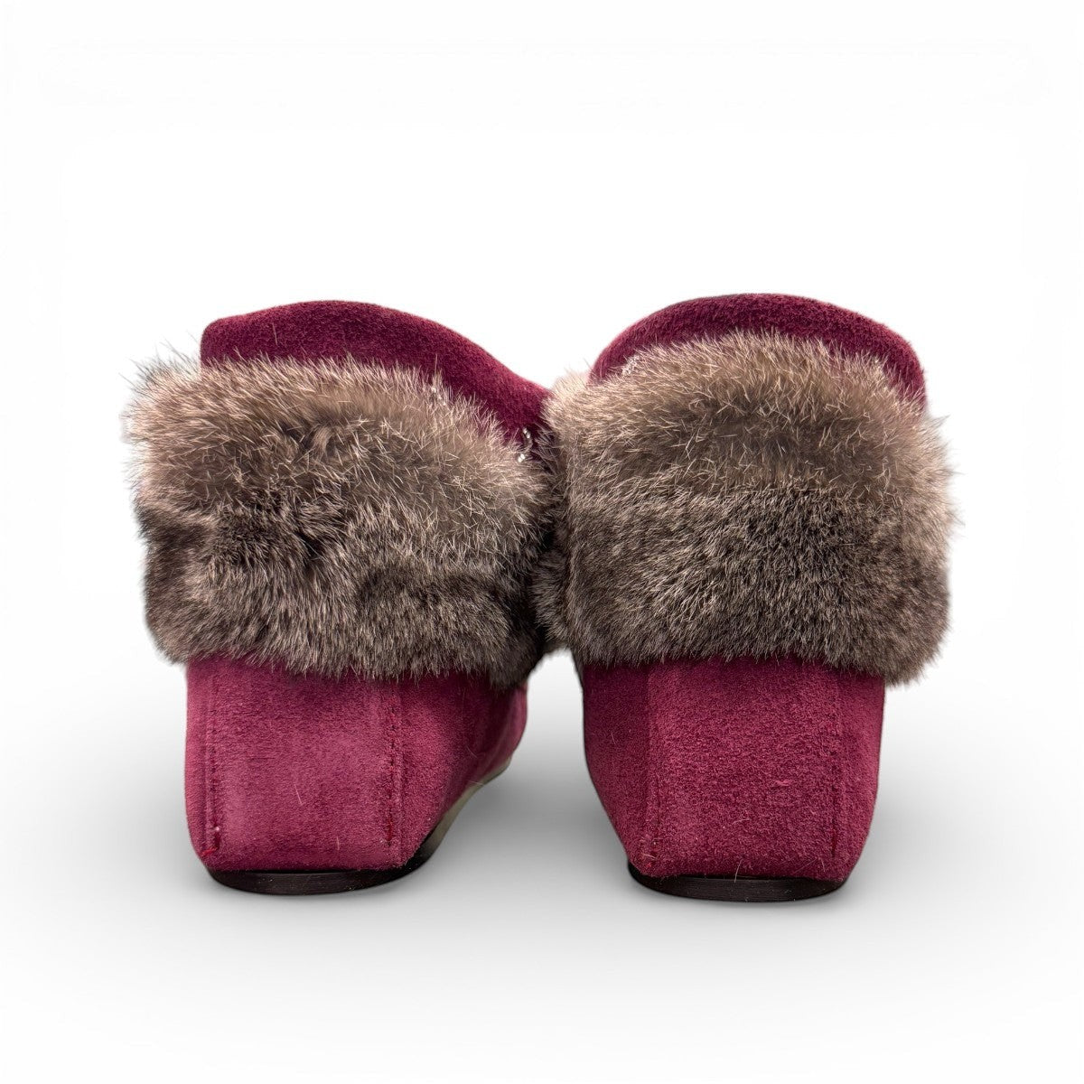 Laurentian Chief Nuka bordeaux suede moccasin with fur trim, beaded details, and black crepe sole.