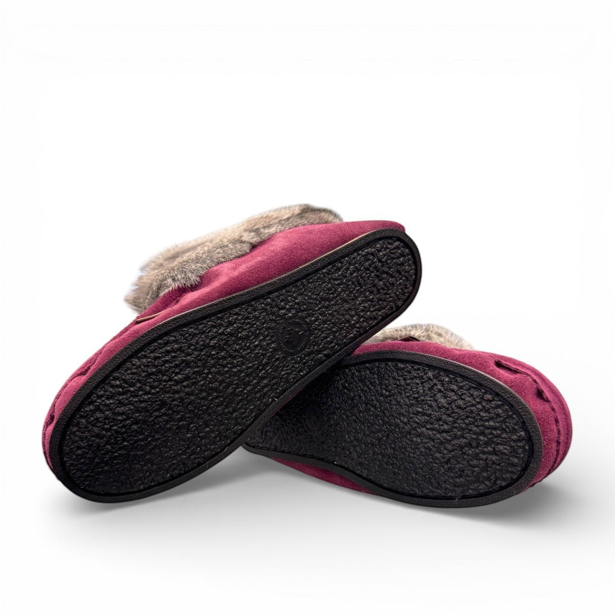 Laurentian Chief Nuka bordeaux suede moccasin with fur trim, beaded details, and black crepe sole.