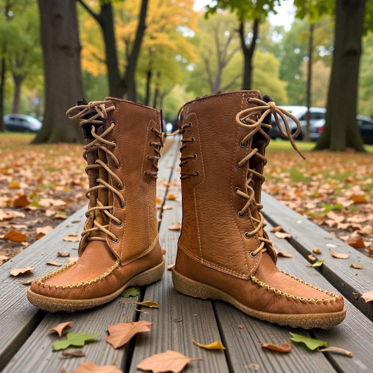 Laurentian Chief mukluk boots in cognac moose hide leather with lace-up front and moccasin stitching.